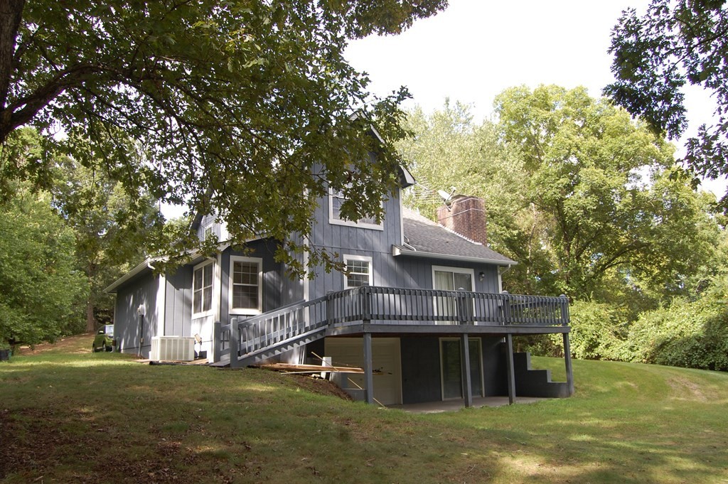 289 Dogwood Circle Decatur, TN 37322 - Photo 4 of 42 a view of a house with a yard plants and large tree
