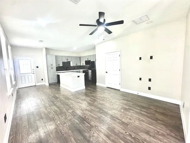 a kitchen with stainless steel appliances a refrigerator and a stove