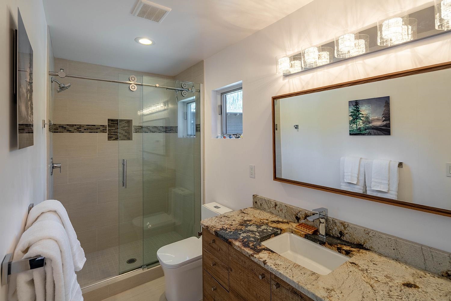 120 Smiley Circle Olympic Valley, CA 96146 - Photo 12 of 21 a bathroom with a granite countertop sink mirror toilet and shower