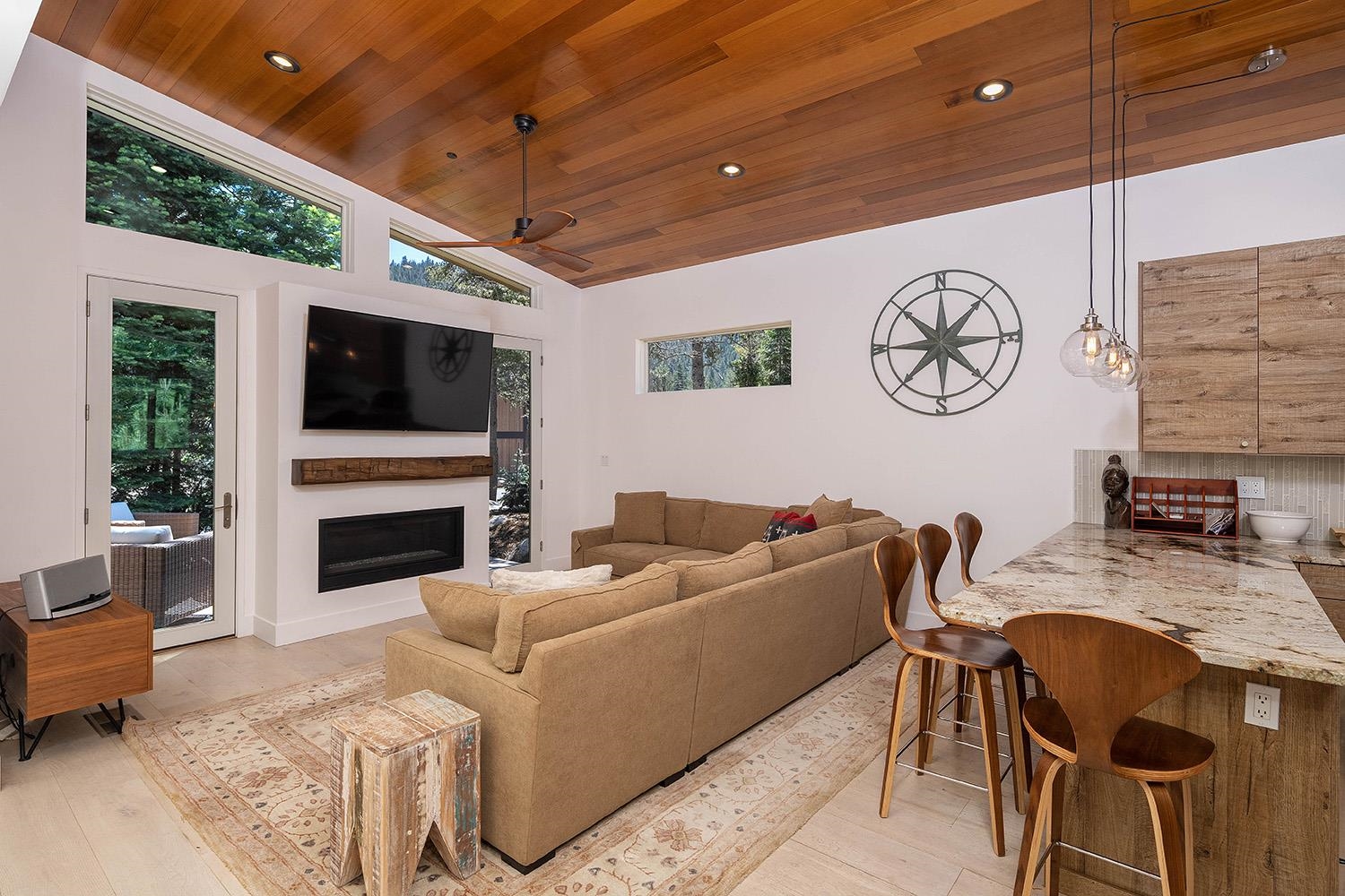 120 Smiley Circle Olympic Valley, CA 96146 - Photo 4 of 21 a living room with furniture a fireplace and a flat screen tv