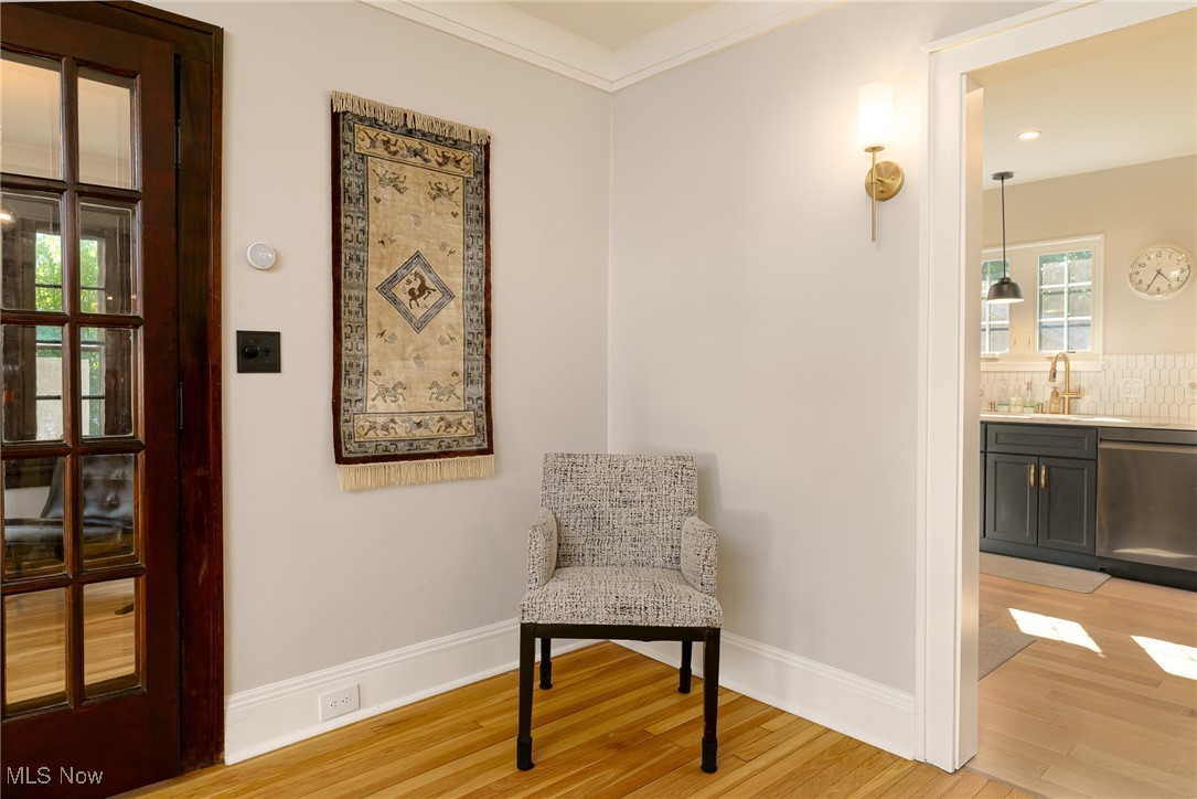 2624 Lee Road Cleveland, OH 44118 - Photo 20 of 50 Living area featuring ornamental molding, light hardwood / wood-style flooring, and sink
