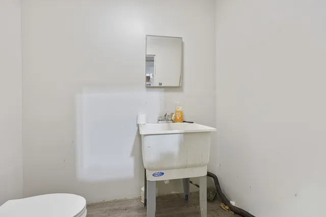 a view of kitchen with cabinets and wooden floor