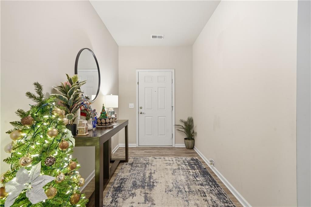 16 Brandon Lane Rome, GA 30165 - Photo 11 of 37 a living room with a rug and a potted plant