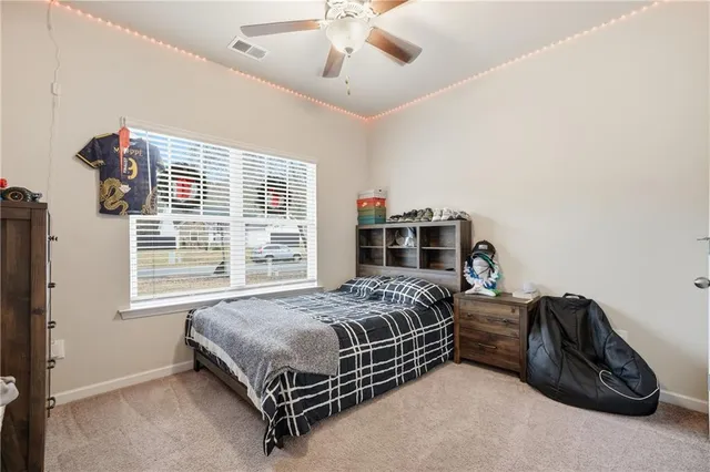 a bedroom with a bed and cabinets