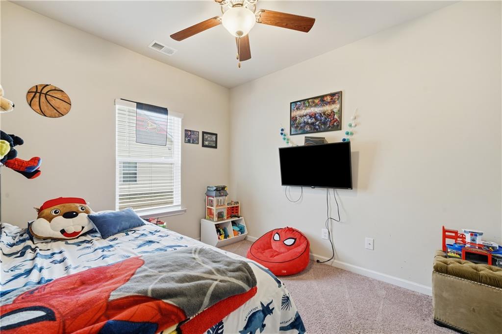 16 Brandon Lane Rome, GA 30165 - Photo 15 of 37 a bedroom with furniture and a flat screen tv