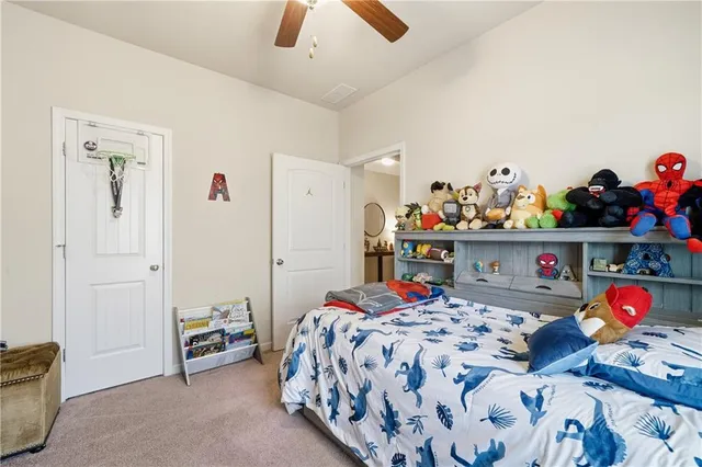 a view of a workspace with furniture and wooden floor