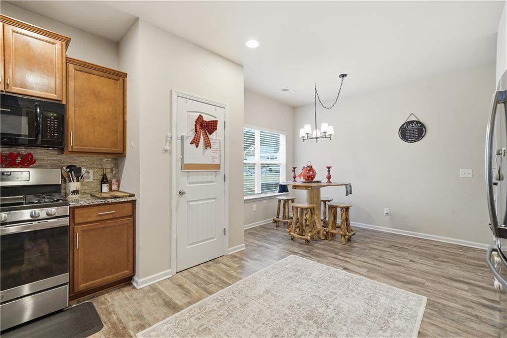 16 Brandon Lane Rome, GA 30165 - Photo 18 of 37 a kitchen with stainless steel appliances granite countertop a refrigerator and a stove top oven