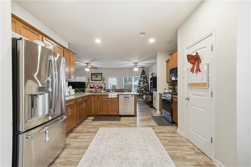 16 Brandon Lane Rome, GA 30165 - Photo 19 of 37 a kitchen with refrigerator and cabinets