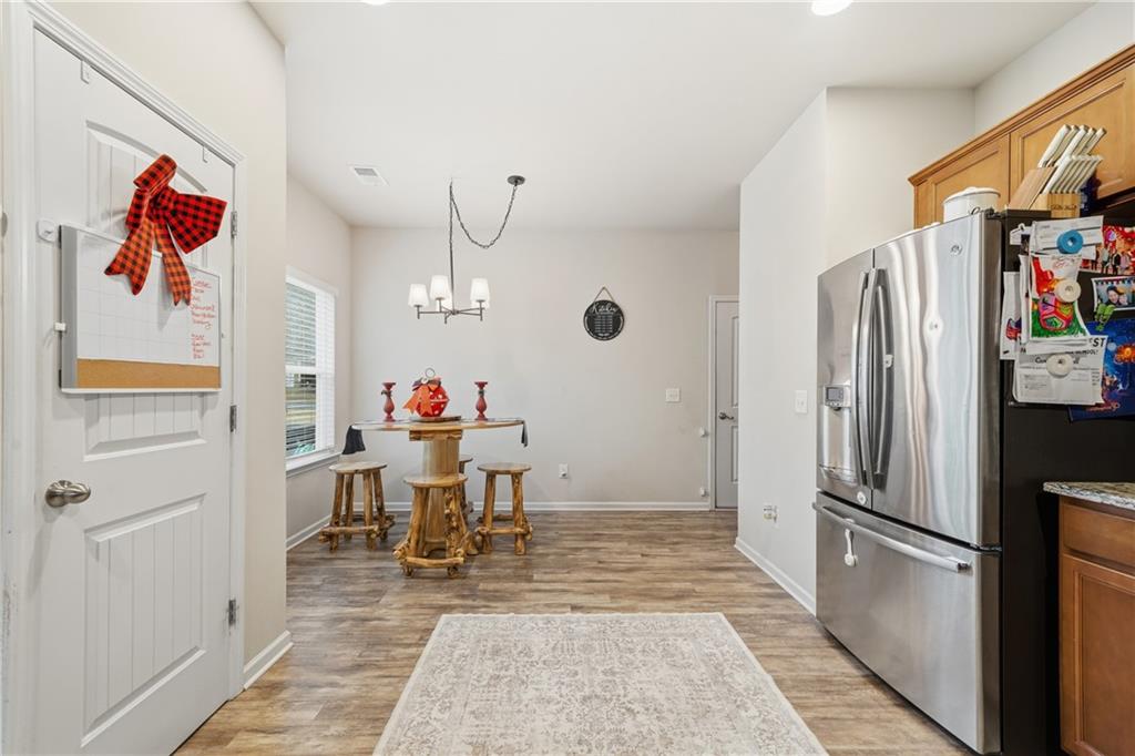 16 Brandon Lane Rome, GA 30165 - Photo 20 of 37 a living room with dining table furniture and a kitchen view