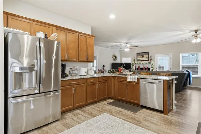 a kitchen with cabinets a sink and stainless steel appliances