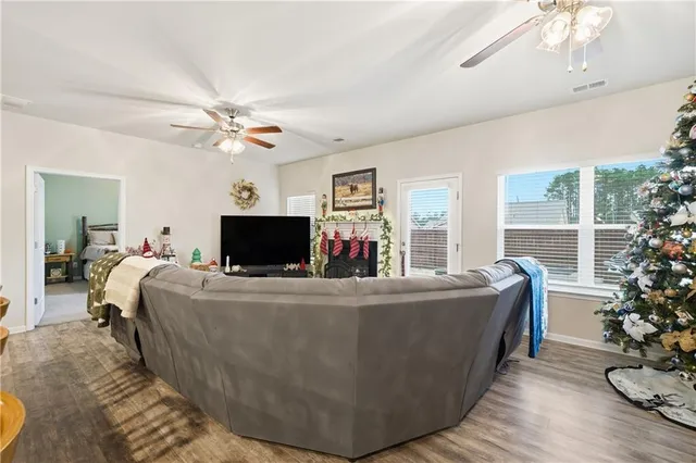 a view of a dining room with furniture and wooden floor