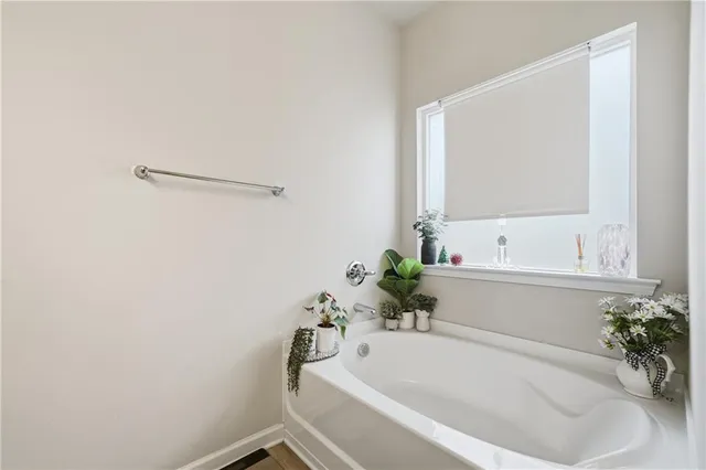 a bathroom with a tub and shower