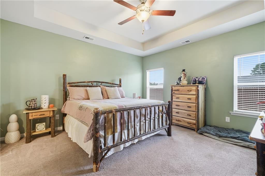 16 Brandon Lane Rome, GA 30165 - Photo 32 of 37 a bedroom with a bed and a chandelier