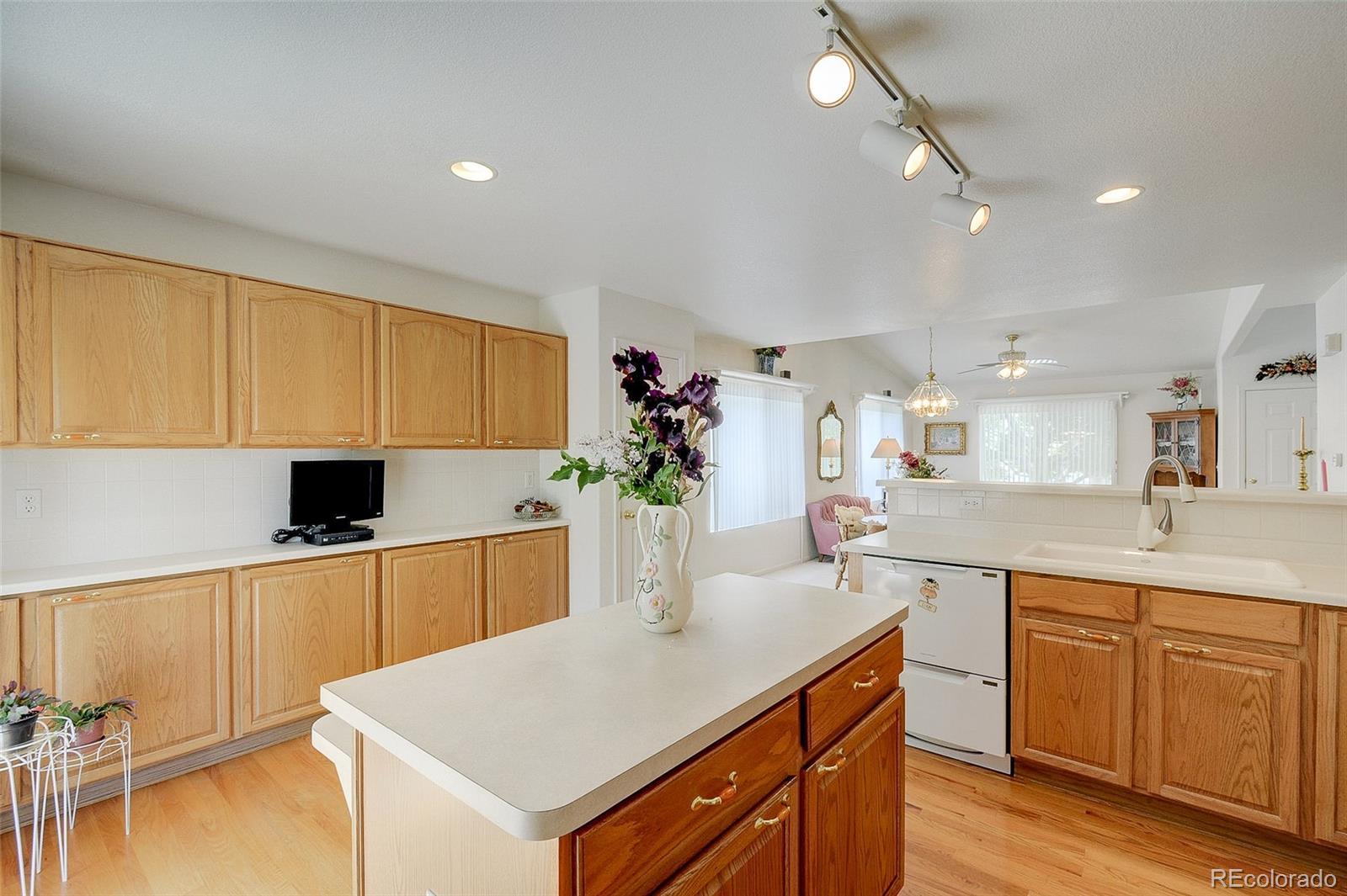 1237 Trail Ridge Road Longmont, CO 80504 - Photo 11 of 34 a kitchen with a sink a counter space and appliances
