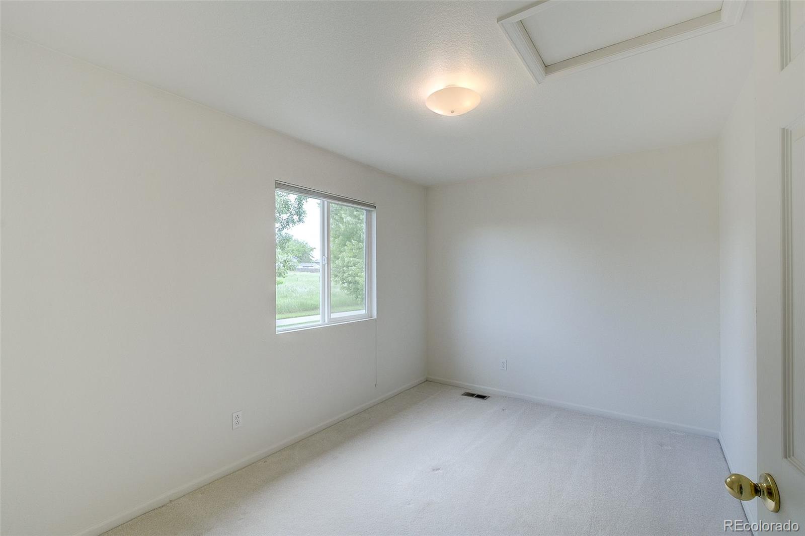 1237 Trail Ridge Road Longmont, CO 80504 - Photo 15 of 34 an empty room with a window
