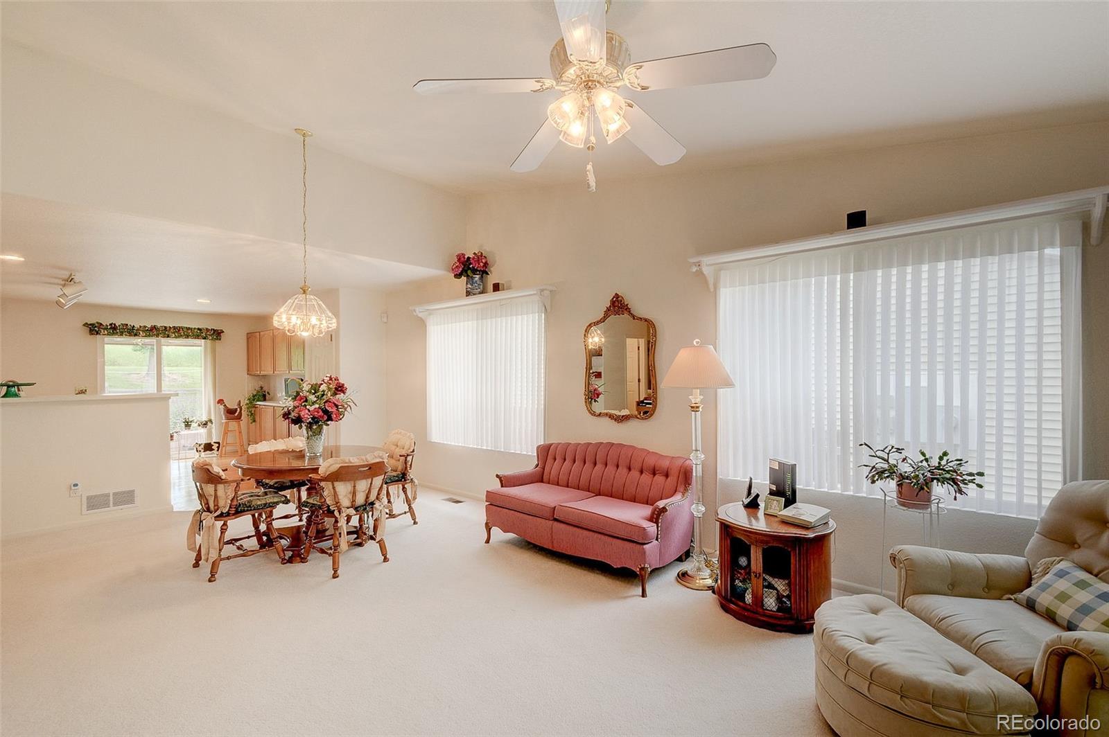 1237 Trail Ridge Road Longmont, CO 80504 - Photo 2 of 34 a living room with furniture and a large window