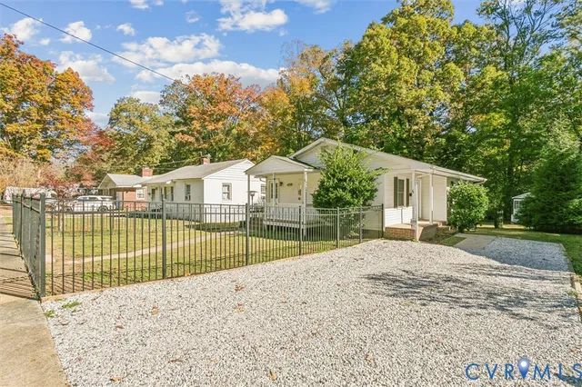 a view of a backyard with a large tree