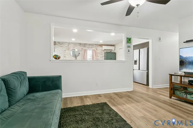 a living room with furniture and a rug