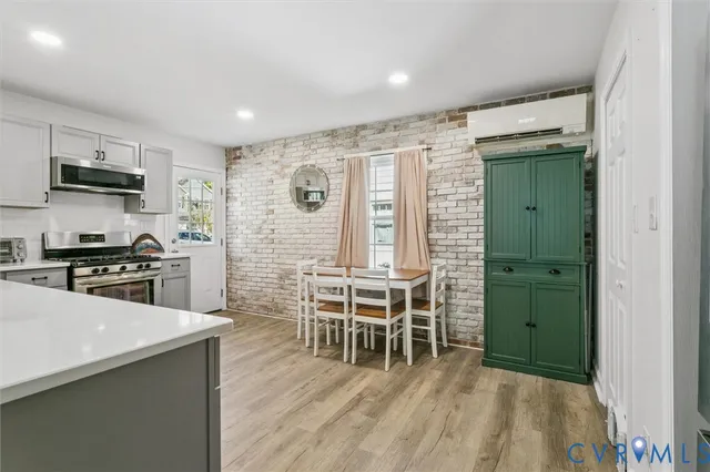 a kitchen with stainless steel appliances granite countertop a stove top oven a sink and dishwasher