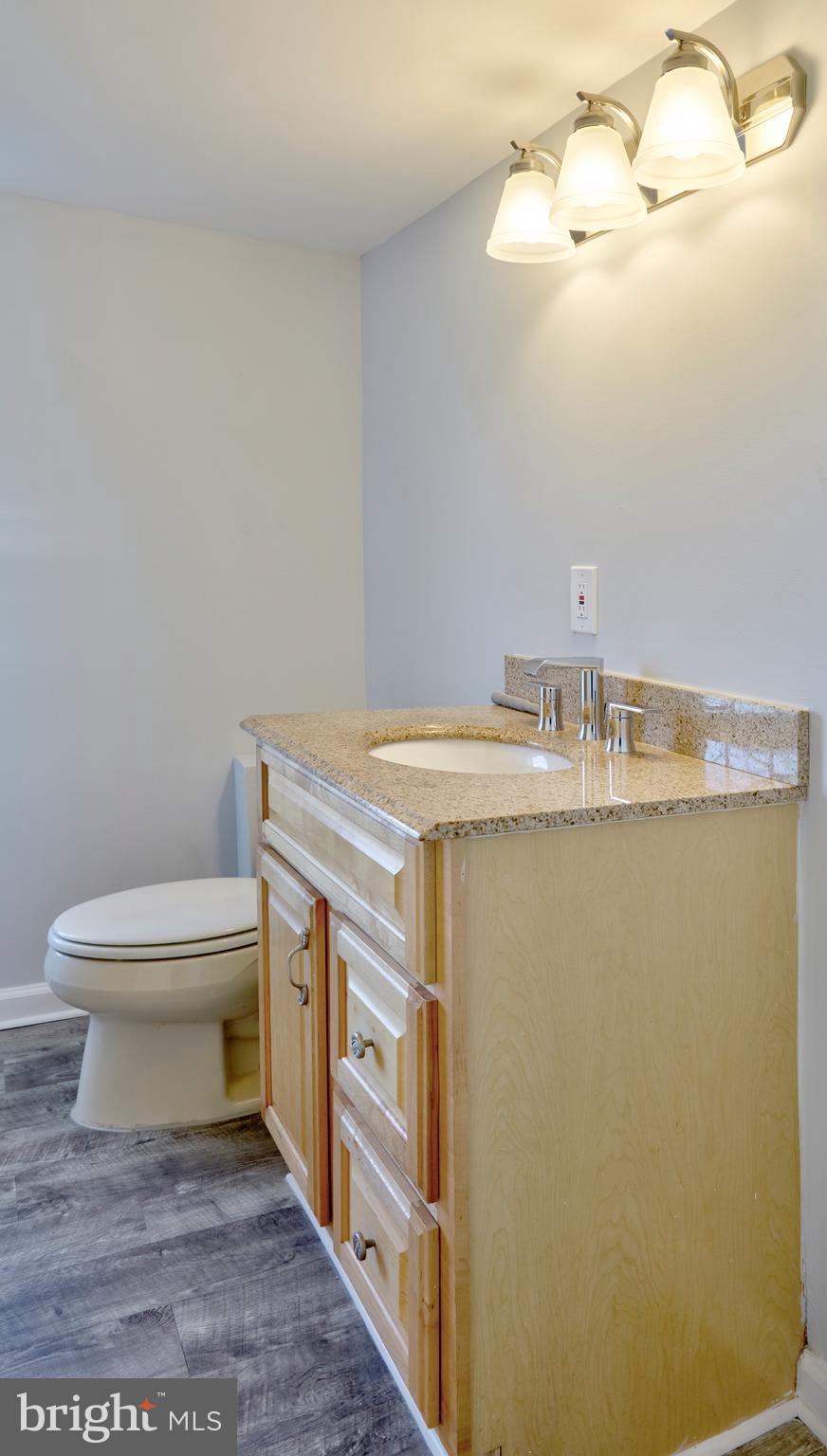 44 Cedarbrook Road Sicklerville, NJ 08081 - Photo 12 of 25 a bathroom with a granite countertop toilet and a sink