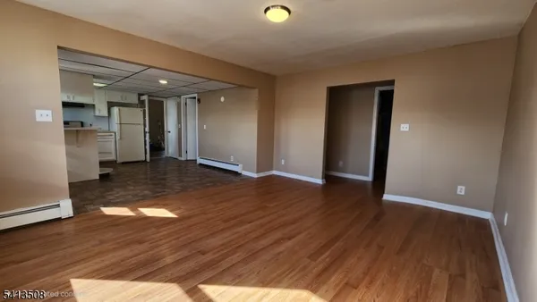 a view of a livingroom with wooden floor