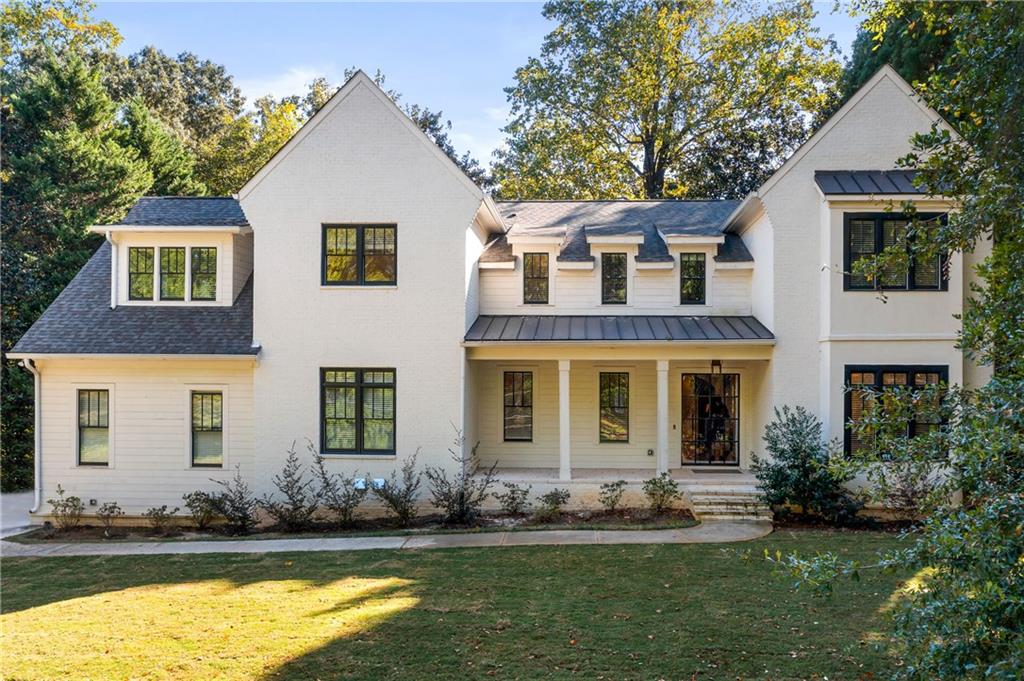 2731 Arden Road Northwest Atlanta, GA 30327 - Photo 1 of 1 a front view of a house with a yard