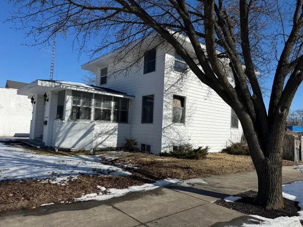 a view of a house with a tree