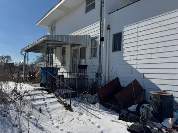 a view of house with patio outdoor seating