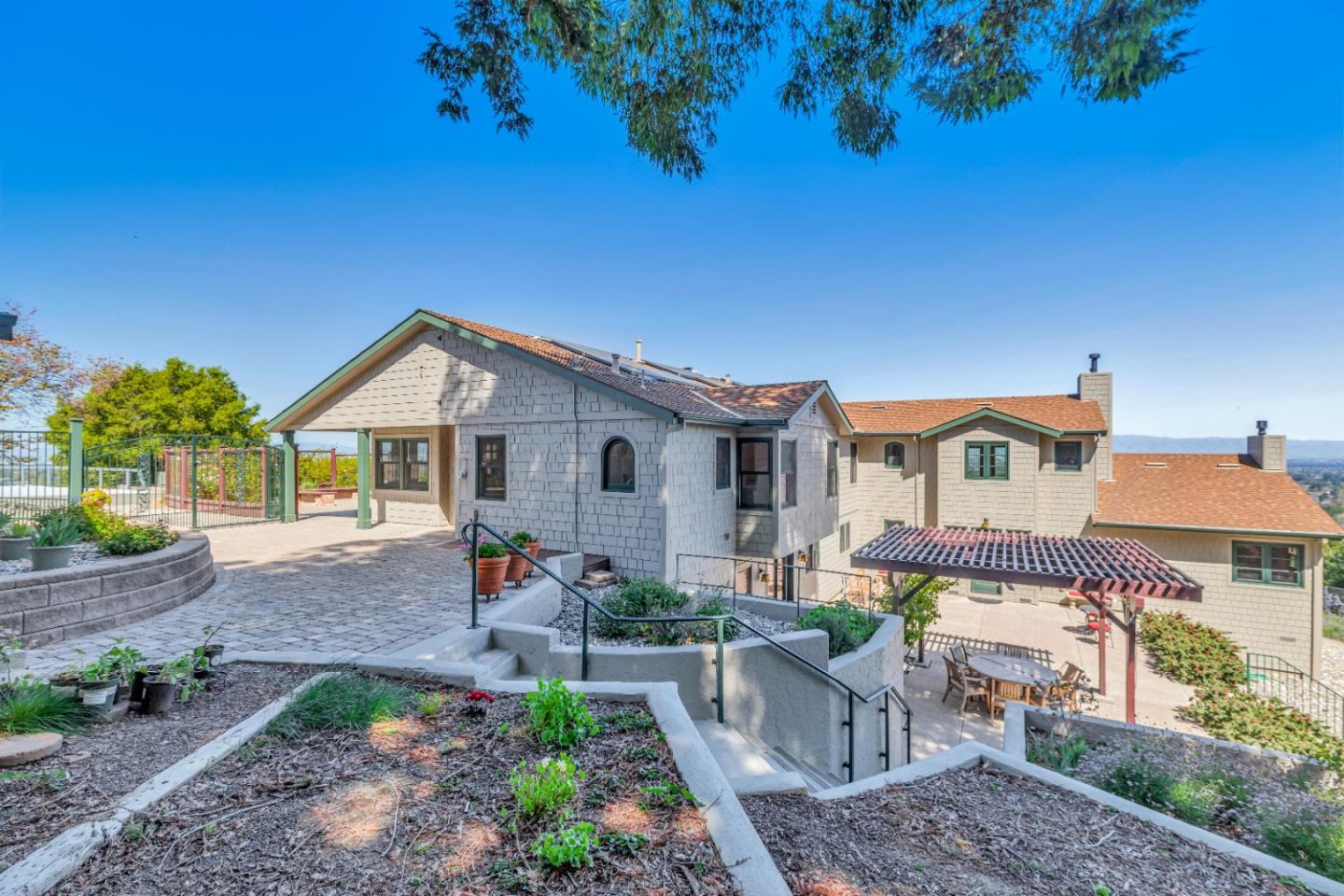 22820 San Juan Road Cupertino, CA 95014 - Photo 1 of 100 a front view of a house with garden