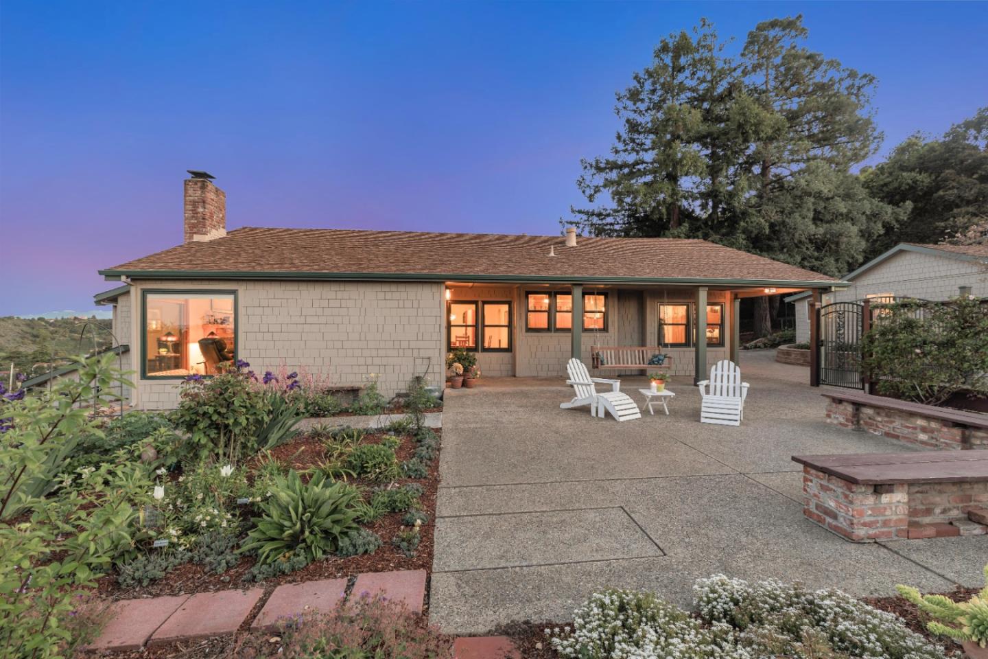 22820 San Juan Road Cupertino, CA 95014 - Photo 2 of 100 a view of a patio with table and chairs under an umbrella