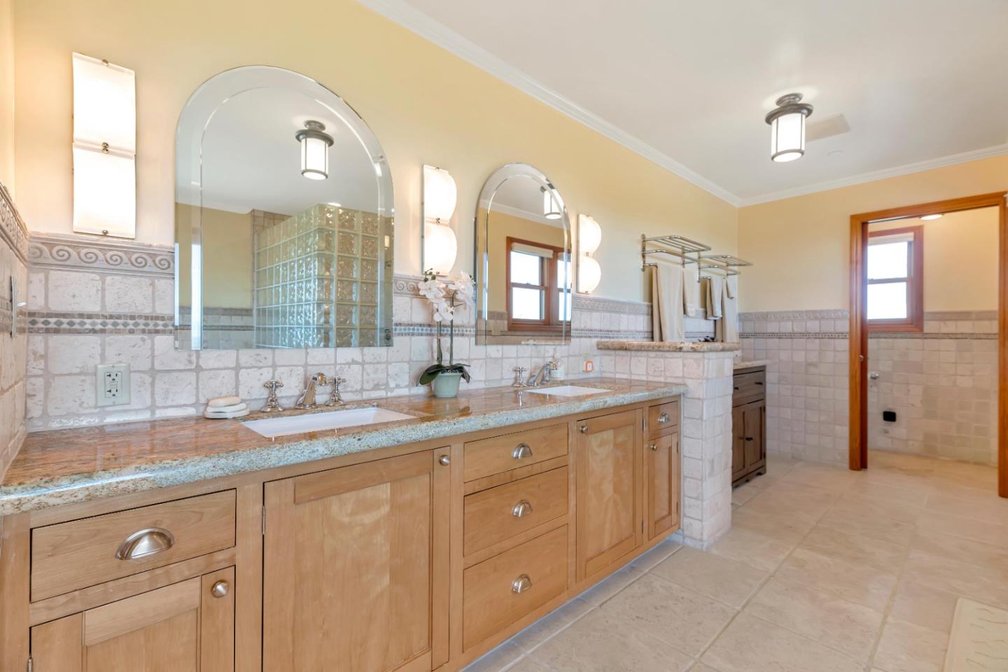 22820 San Juan Road Cupertino, CA 95014 - Photo 25 of 100 a spacious bathroom with a granite countertop sink a large mirror and a shower