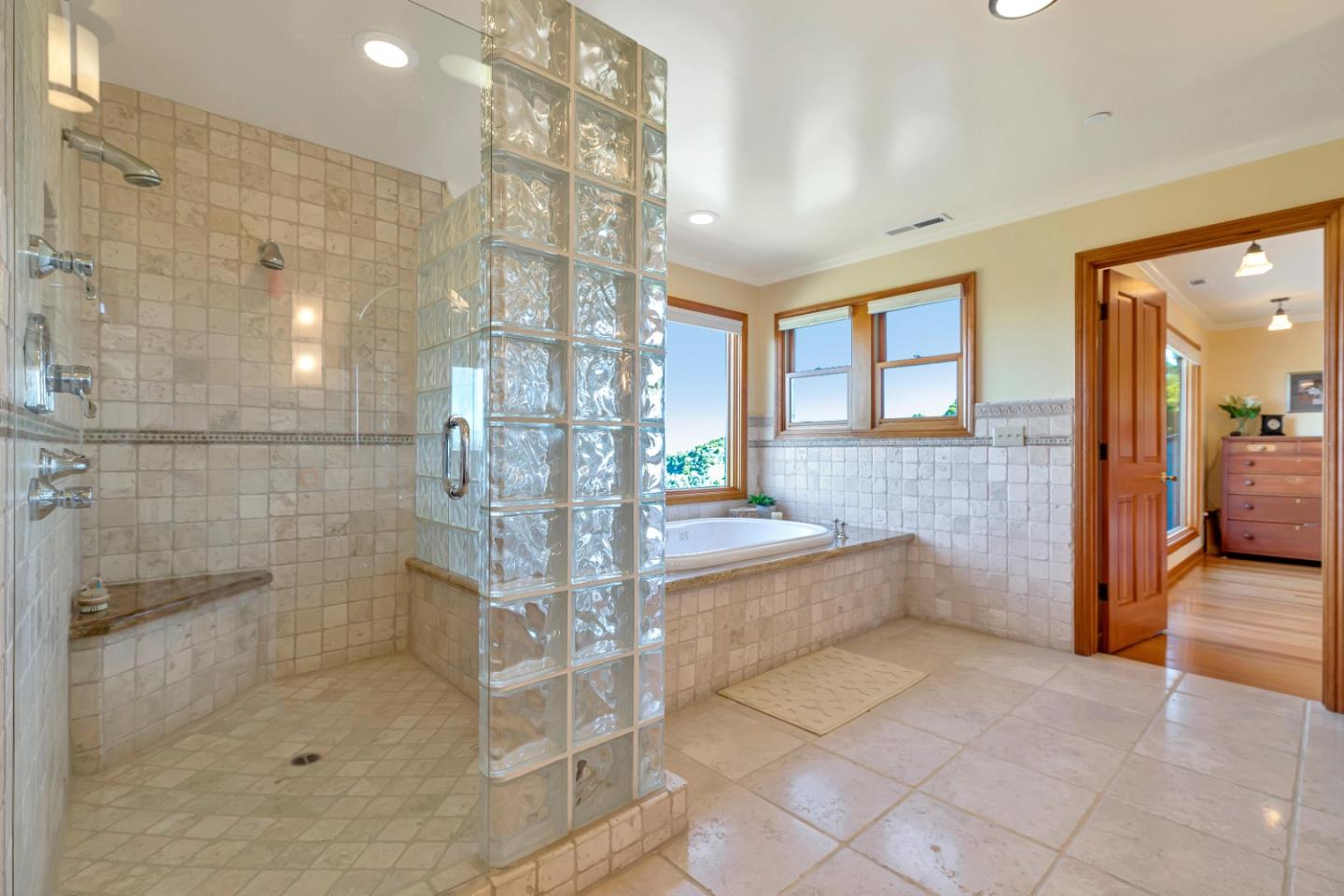 22820 San Juan Road Cupertino, CA 95014 - Photo 26 of 100 a bathroom with a glass shower door