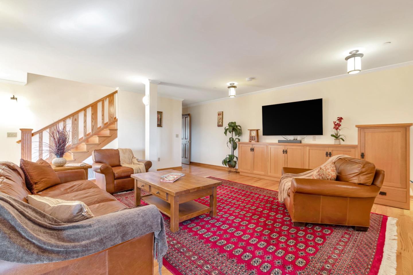 22820 San Juan Road Cupertino, CA 95014 - Photo 32 of 100 a living room with furniture and a flat screen tv