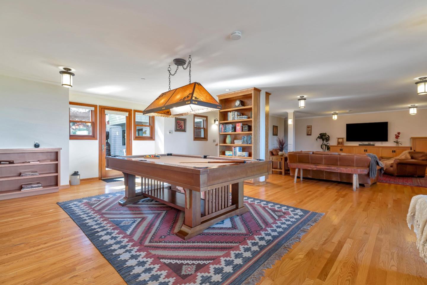 22820 San Juan Road Cupertino, CA 95014 - Photo 33 of 100 a living room with furniture a pool table and a fireplace