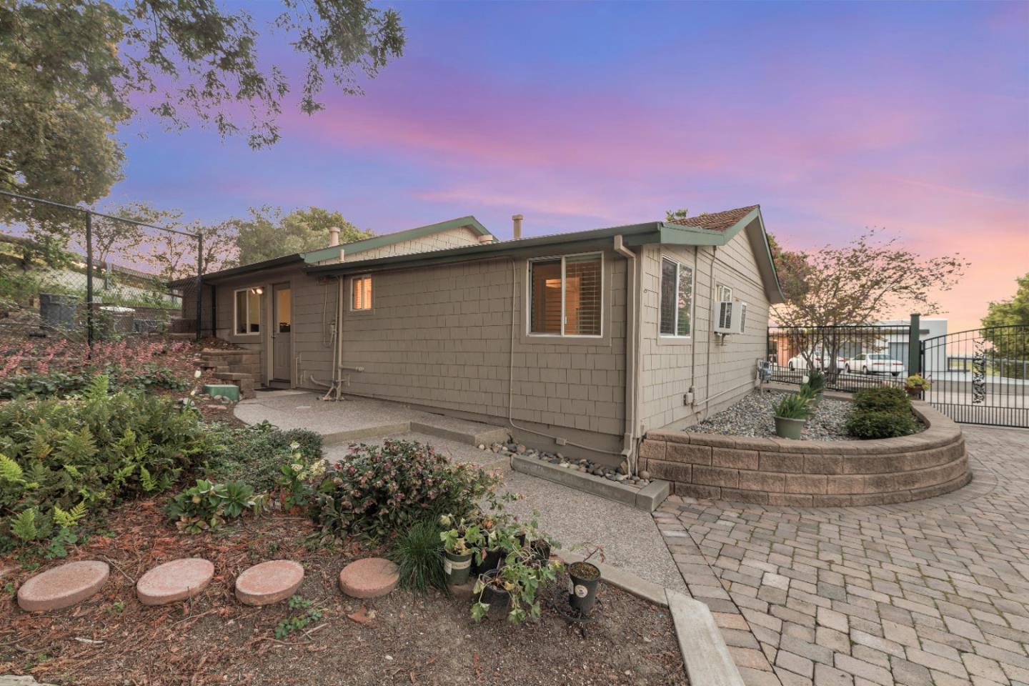 22820 San Juan Road Cupertino, CA 95014 - Photo 92 of 100 a front view of a house with a yard