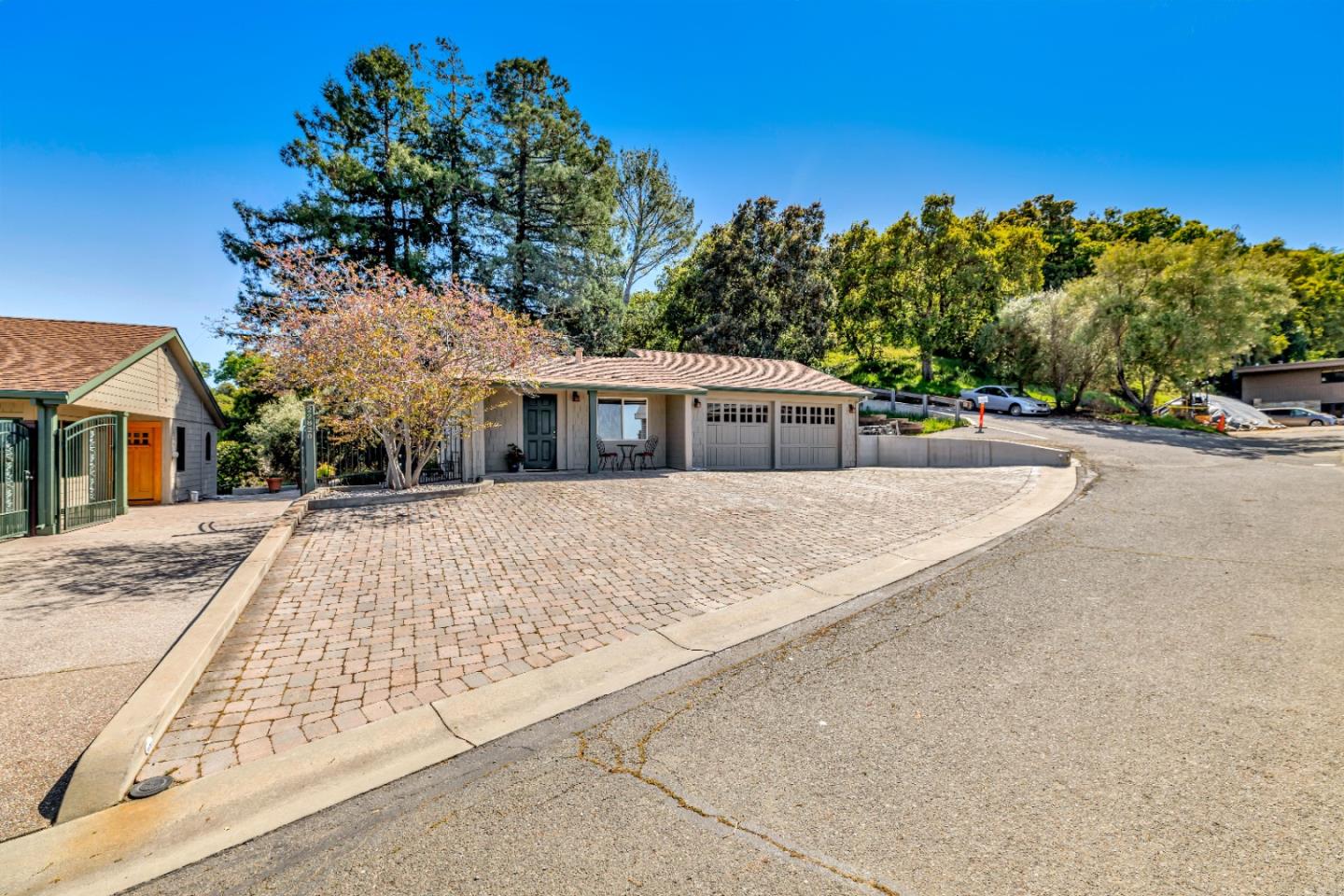 22820 San Juan Road Cupertino, CA 95014 - Photo 10 of 100 front view of house with a yard and trees all around