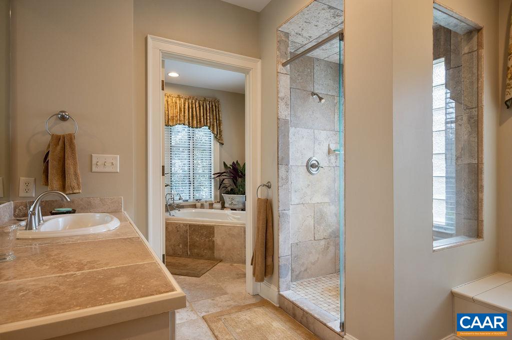 4051 Ballards Mill Road Free Union, VA 22940 - Photo 23 of 49 a bathroom with a tub shower and sink