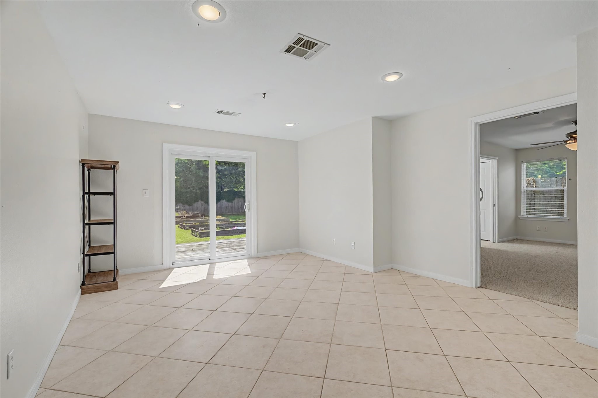 413 Farrer Street Angleton, TX 77515 - Photo 13 of 43 a view of an empty room with a window