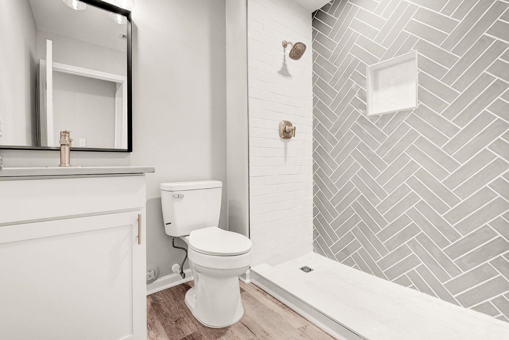 6500 Hammersmith Drive Raleigh, NC 27613 - Photo 14 of 21 a bathroom with a toilet sink and a shower