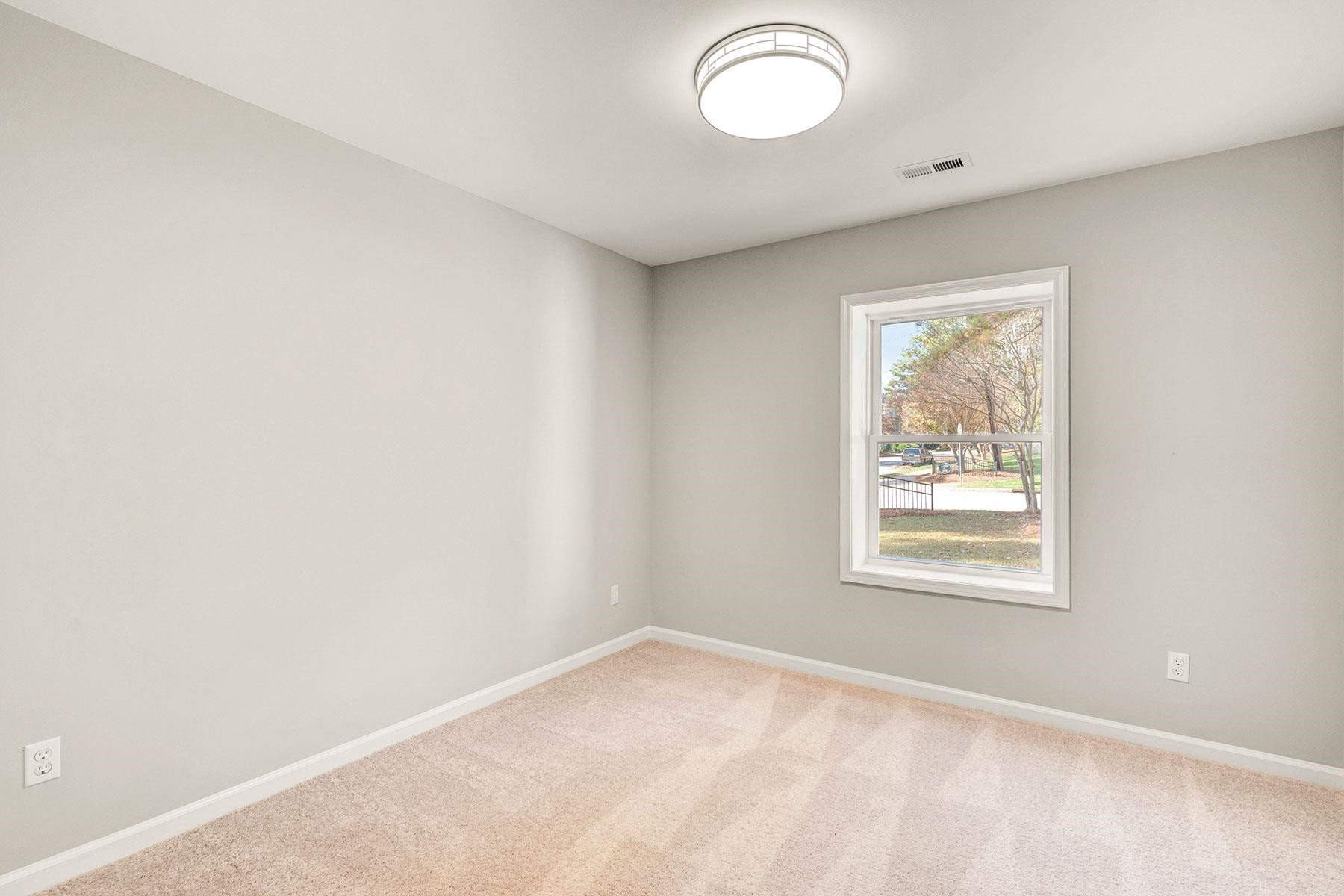 6500 Hammersmith Drive Raleigh, NC 27613 - Photo 15 of 21 an empty room with windows