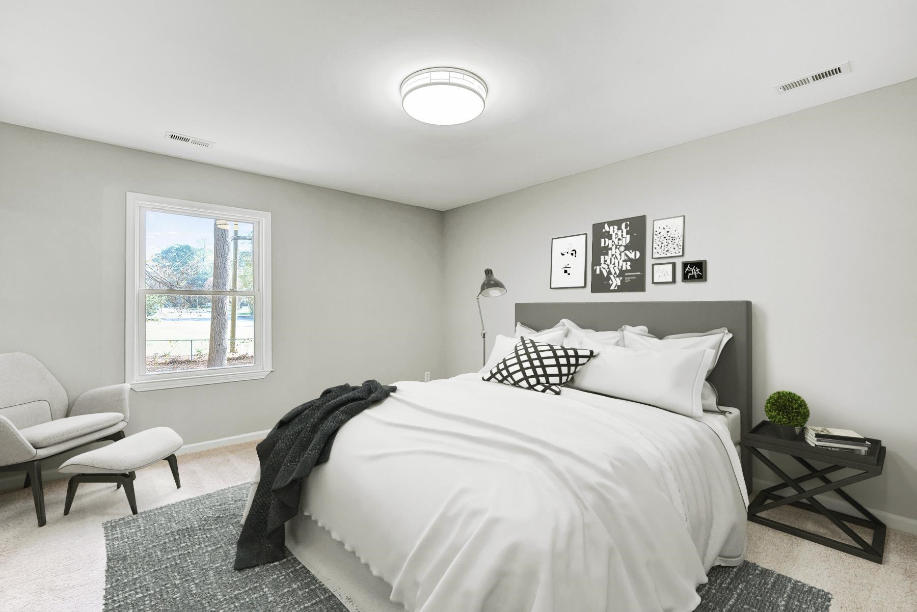 6500 Hammersmith Drive Raleigh, NC 27613 - Photo 16 of 21 a bedroom with a bed and a chair