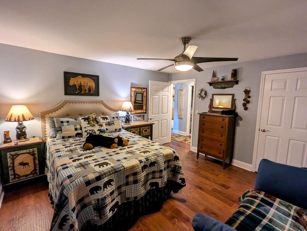 96 Cascade Trail, Unit 24 Fancy Gap, VA 24328 - Photo 11 of 18 a bedroom with bed and wooden floor