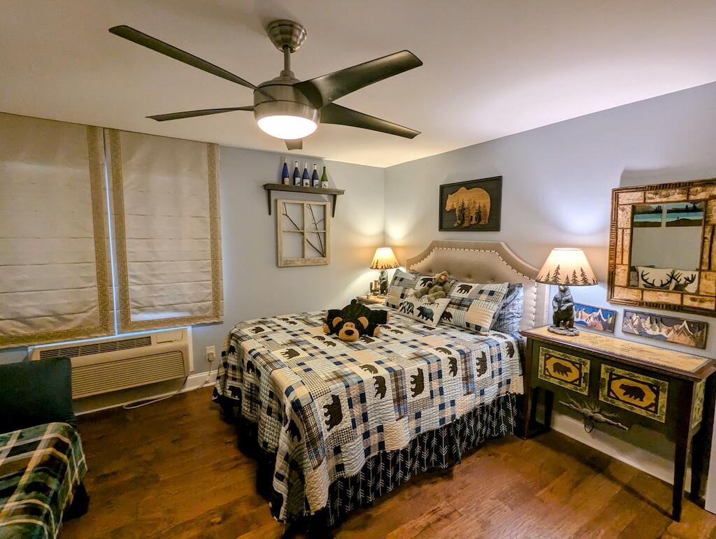 96 Cascade Trail, Unit 24 Fancy Gap, VA 24328 - Photo 12 of 18 a bedroom with a bed a dresser next to a window