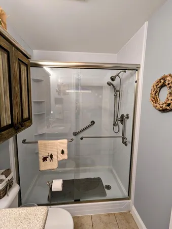 a bedroom with a bed and a lamp