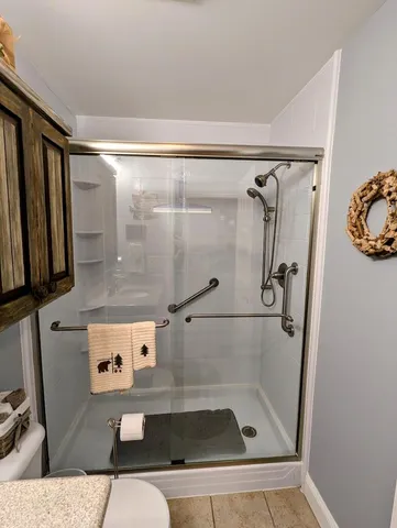 a bedroom with a bed and a lamp