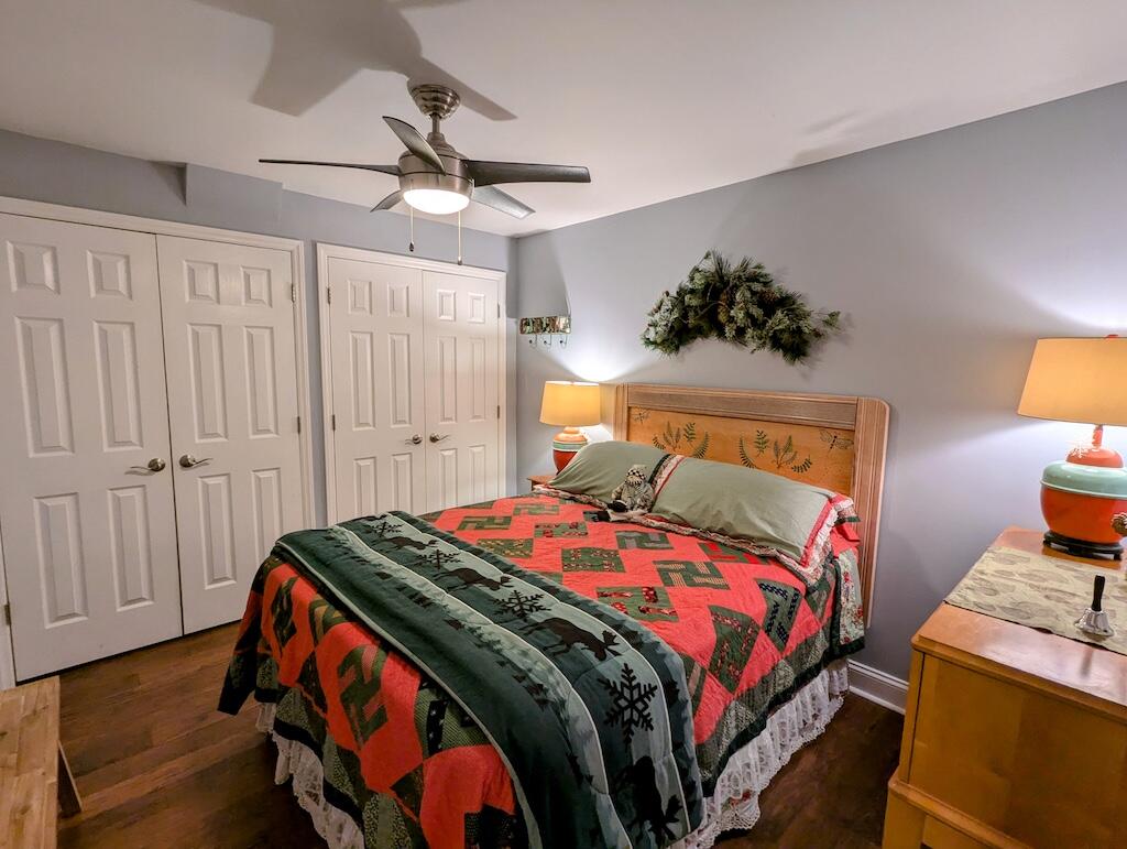 96 Cascade Trail, Unit 24 Fancy Gap, VA 24328 - Photo 15 of 18 a bedroom with a bed and a lamp