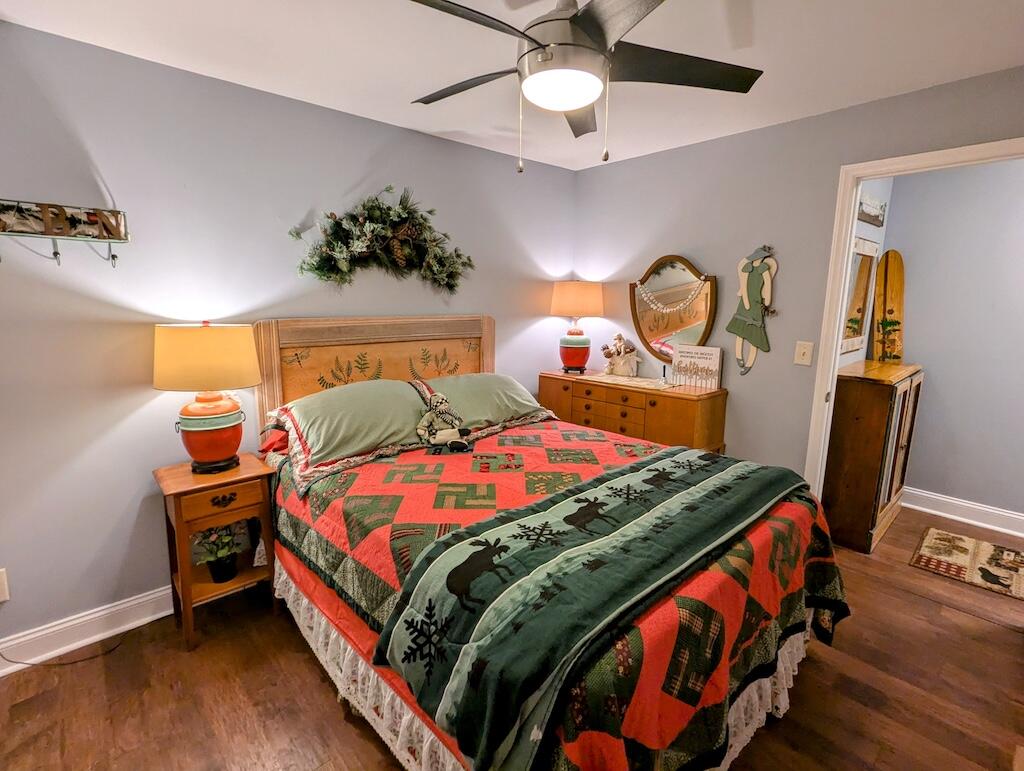 96 Cascade Trail, Unit 24 Fancy Gap, VA 24328 - Photo 16 of 18 a bedroom with a bed and a chandelier