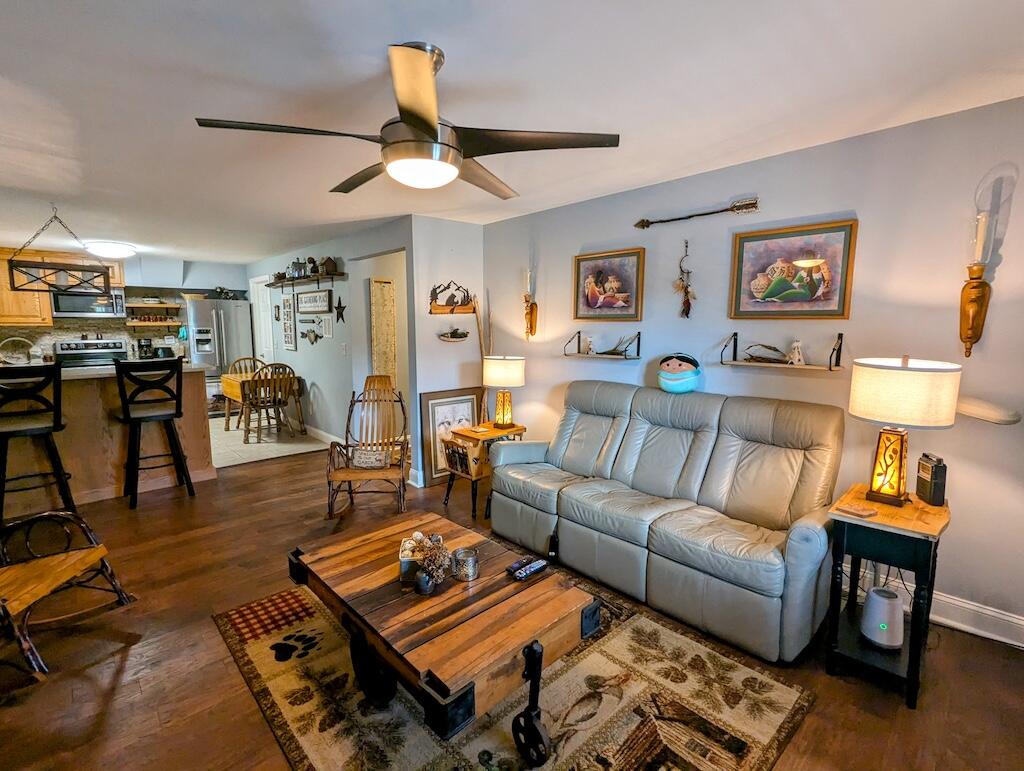 96 Cascade Trail, Unit 24 Fancy Gap, VA 24328 - Photo 4 of 18 a living room with furniture and wooden floor