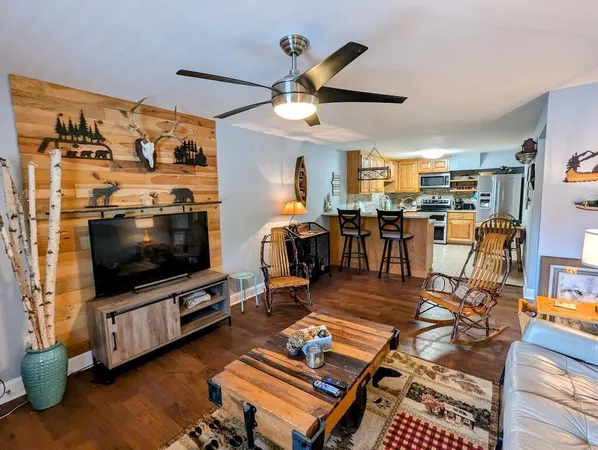 a kitchen with cabinets stainless steel appliances and a window
