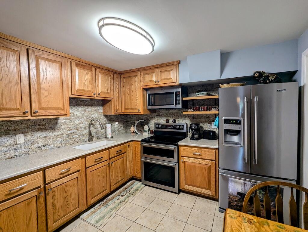 96 Cascade Trail, Unit 24 Fancy Gap, VA 24328 - Photo 7 of 18 a kitchen with cabinets stainless steel appliances and a window